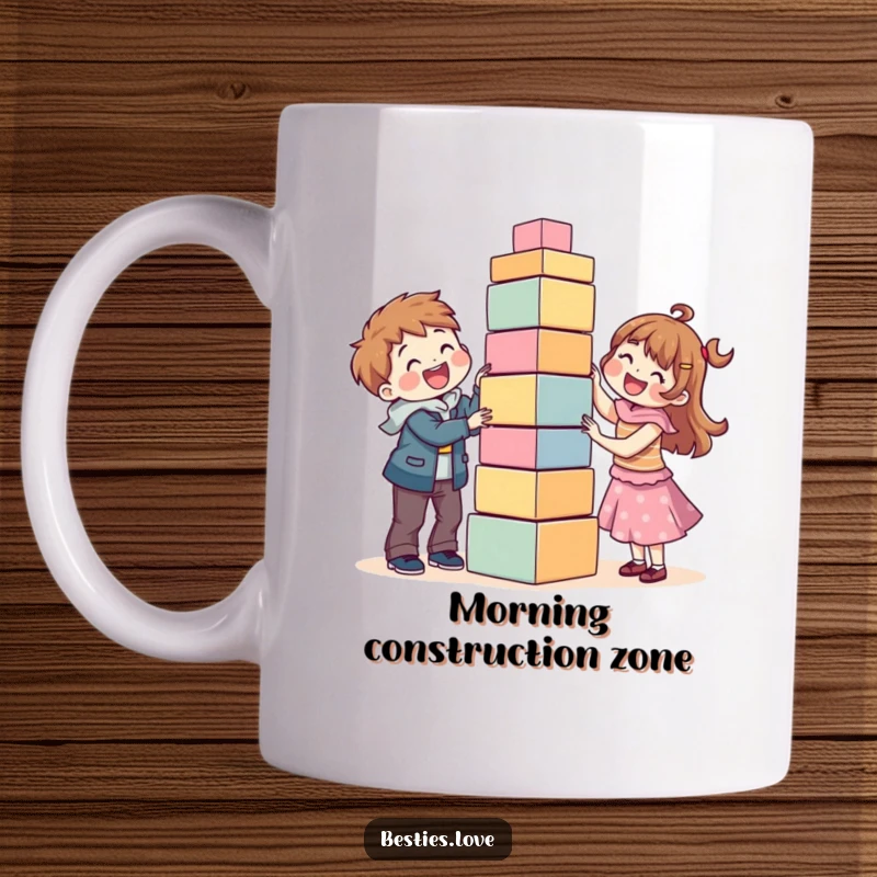 Funny coffee mug showing two happy best friends precariously building a tall, wobbly tower out of colorful blocks together.